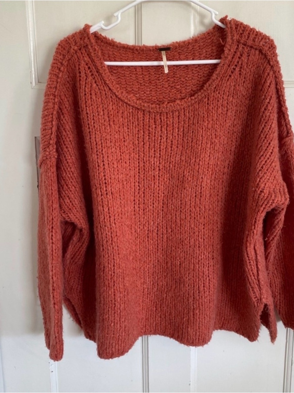 Free People coral pink sweater size xs.